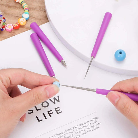 Hands using purple diamond-tipped bead reamer set of four for jewelry making hole enlarger tools with durable plastic handles