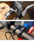 Close-up of ✝️ SPEEDWOX 6pcs Bicycle Stem Screw with Washers Set Titanium Alloy Bike Allen Hex Tapered Bolts on a bike handlebar