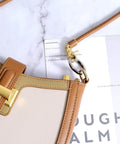 4 Pack Silver Metal O Ring Set For Purses And Handbags, Keys And Carabiners, attached to a tan leather bag handle, rust resistant alloy.