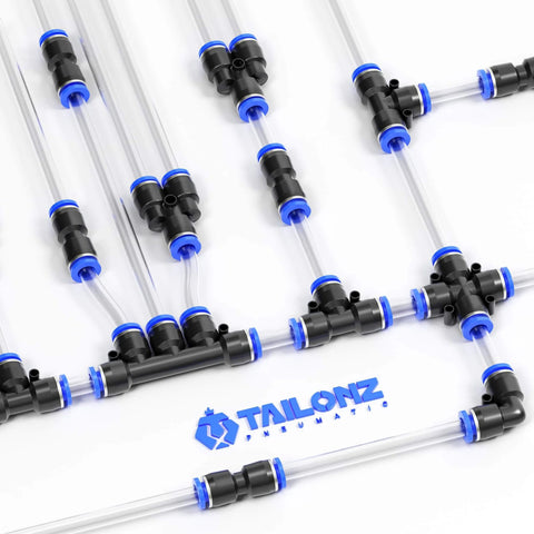 One Quarter Inch OD Push To Connect Pneumatic Fittings Kit with Forty Pieces including splitters, elbows, tees, and straights on display