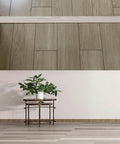 Self Adhesive Flat Floor Transition Strip in Yellow Oak connecting PVC laminate floors, showing seamless threshold divider installation.