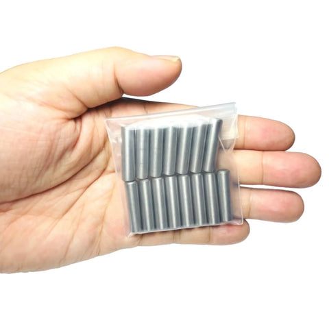 Hand holding a pack of 15 Quarter Inch Dowel Pins Kit One Inch Long Metal Shelf Pins for Shelves Bunk Beds Woodworking Alloy Steel Bearings.