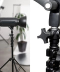 Close-up of photographic light stand with 5 Pack Quarter Inch 20 TPI Four Point Knobs With 2 Inch Threaded Studs for secure adjustment