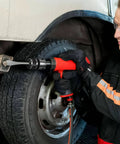 Mechanic using Air Hammer Quick Change Chisel Retainer Chuck on vehicle, easy to install, stable spring retainer visible