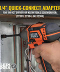 Person using a Klein Tools impact driver with 1/4 inch quick-connect adapter to install wiring on an electrical panel.