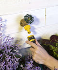 Hand using 5 Piece Quick Connect Starter Set And Faucet Adapters Bundle For Garden Hoses, Water Stop, Locking Connection