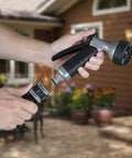 Hands demonstrating 5 Piece Quick Connect Starter Set And Faucet Adapters Bundle For Garden Hoses, featuring a water stop function.