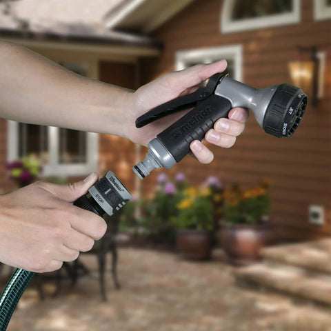 Hands demonstrating 5 Piece Quick Connect Starter Set And Faucet Adapters Bundle For Garden Hoses, featuring a water stop function.
