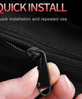 Close-up of black zipper slider from Six Pack Zipper Pull Replacements Kit for Clothing Jackets Backpacks Purses and Coats.