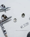 Quick Release Coupling Kit For Spray Gun Hoses, DIY Friendly 1/8 Inch BSP Male And Female Connectors on white surface