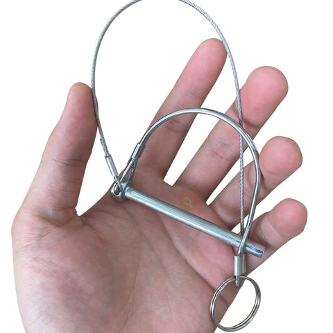 Person holding 10 Pack Trailer Coupler Pins 1/4 Inch Diameter And 2 3/4 Inch Length With Quick Release Ring and wire shaft