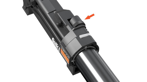 Close-up of Quik Drive tool adjustment knob on metal shaft with directional arrow for functionality guidance and secure fastening.