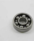 R3 Open Bearing 3/16" x 1/2" x 0.156" - Miniature chrome steel ball bearing on white background