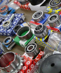 Assorted precision bearings, including Radial Deep Groove Ball Bearing 6416M, arranged for shipping in 3-5 days on a table.