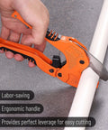 Person using a Ratcheting PVC Pipe Cutter for 1-1/4 in Pipes with Manganese Steel Body and Rubber Handle on white pipe