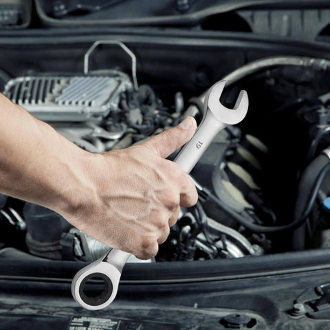 Hand using Go To Eight Piece Metric Ratcheting Wrench Set With Organizer Rack Cr V Steel 8 Mm To 19 Mm on car engine