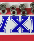 10-Pack RC Bearing 5x11x4 for Tamiya & Traxxas Miniature displayed on striped background with VXB logo.
