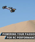 Remote control car jumping over sand dunes in desert terrain, showcasing power and performance against clear sky.