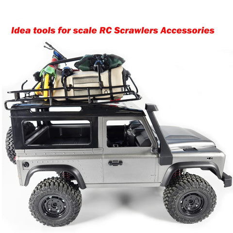 Model RC crawler with assorted mini bungee cords and rooftop gear for small item securing and travel use.