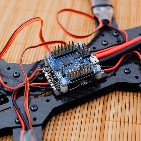 Silent, reliable RC vibration dampers that isolate the flight controller and gimbal from shocks, lowering sensitivity and smoothing aerial performance, fits F4/F7 controllers with M2x4mm mounts, pack of 20 black installed on drone frame.