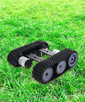 Remote Control RC Robot Tank Car Chassis with DC Motor Kit on grass, durable metal body, adjustable track length for Raspberry Pi and Arduino.