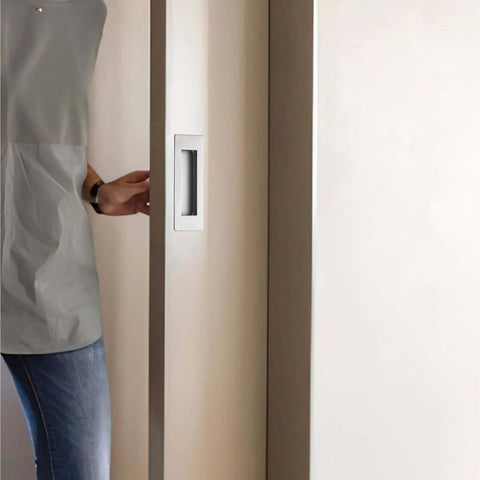 Person using 6 Inch Recessed Finger Flush Pulls For Pocket Doors Sliding Doors Closets And Barn Doors Hardware In Brushed Nickel Silver