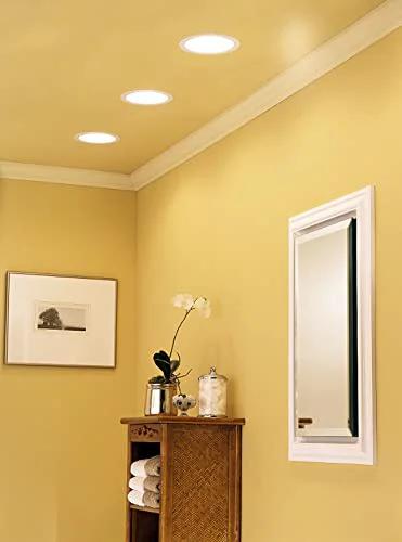 Installed recessed light ventilation fan with 70 CFM 1.5 sones, 4 inch duct in ceiling by Broan NuTone for bathrooms