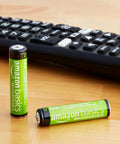 Rechargeable AAA NiMH Batteries 800 mAh Low Self Discharge Precharged 12 Pack next to remote control on table