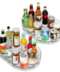 360 Degree Rotating Refrigerator Lazy Susan Turntable 13.5 Inch By 8.5 Inch Clear Plastic Organizer with various condiments.
