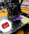 Two-Piece Red 25mm Die Springs With 30mm Free Length for die machinery and 3D printer parts, shown with a 3D printer setup.