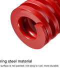 Close-up of two-piece red 25mm die springs, 30mm free length, 65Mn material, medium-load compression for die machinery and 3D printer parts.