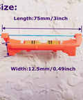Close-up of a red acrylic line level measuring 75x12.5mm, part of Five Piece Red Hanging Line Level Set For Quick Layout And Bricking Site Lining Flooring Decking Ground Shed Base Backyard Fence And Pier Slopes Acrylic 75x12.5mm 3 Inch String Level Tools on textured surface