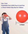 Child holding 2.75 Inch Big Ball Pit Balls - Crush Proof Plastic Balls with a red ball next to size text, ideal for toddlers.
