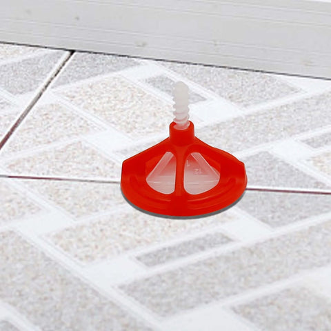 One Eighth Inch Tile Leveling System With Spiral Spacers And Red Reusable Caps Kit on tiled floor