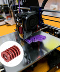 Die Springs For 3D Printers And Die Machinery Pack Of 20 Red Spiral Compression Springs in use with a 3D printer at work