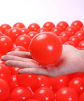 Hand holding 2.75 Inch Big Ball Pit Balls - Crush Proof Plastic Balls for Ball Pit Pack of 50pcs Set for Toddlers