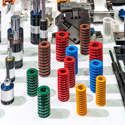 Two Pack Red Die Springs for 3D Printers, 20mm Outer Diameter, part of assorted colored springs displayed with industrial tools