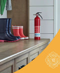Image of Home Fire Extinguisher UL Rated 1A 10B C Multipurpose Unit With All Metal Construction placed on a countertop next to boots.