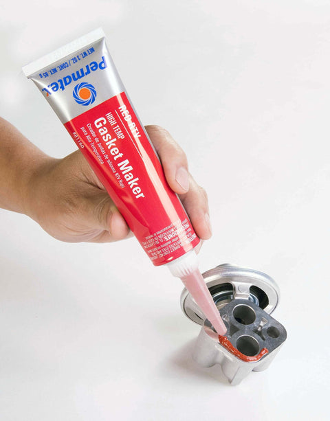 Go-To High Temp Red RTV Silicone Gasket Sealant 3 Oz Tube Pack Of 12 Replaces Cut Gaskets And Forms In Place shown being applied