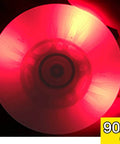 Red luminescent inline skate wheel glowing in the dark, 90A hardness, close-up view showing preinstalled ABEC 9 bearing.
