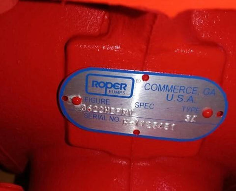 Close-up of nameplate on Generic Roper Pumps 3622HBFRV, 3600 Series - 3" Helical Gear Pump, red with serial number.