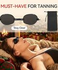 Woman wearing Red Light Therapy Glasses With Adjustable Fit For Eye Protection During Tanning, relaxing indoors.