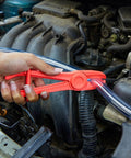 Three Pack Hose Pinch Off Pliers In Red Nylon For Automotive Fuel Line Clamps And Brake Radiator And Coolant Hoses Heat Resistant And Nonconductive Clamp Tool Set For Safe Fluid Line Maintenance in use on vehicle engine hose
