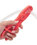 Hand using red nylon pliers to pinch off clear hose, part of Three Pack Hose Pinch Off Pliers In Red Nylon For Automotive Fuel Line Clamps And Brake Radiator And Coolant Hoses Heat Resistant And Nonconductive Clamp Tool Set For Safe Fluid Line Maintenance.