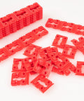Red plastic pieces from Outlet Box Spacers Kit 48 Pack for Loose Outlets and Switches, Wall Plate Stabilizers, Tile Backsplash Extenders