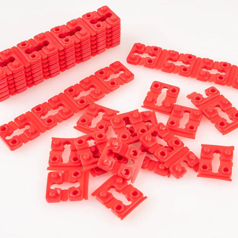 Red plastic pieces from Outlet Box Spacers Kit 48 Pack for Loose Outlets and Switches, Wall Plate Stabilizers, Tile Backsplash Extenders