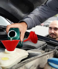 Set Of 5 Plastic Oil Funnels With Long Hose For Automotive Fluid Transfers being used to pour oil into car engine