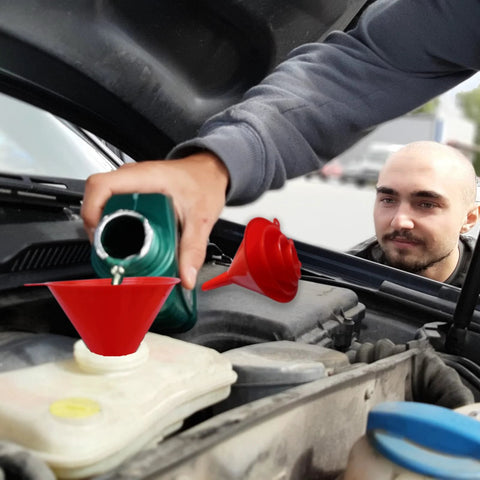 Set Of 5 Plastic Oil Funnels With Long Hose For Automotive Fluid Transfers being used to pour oil into car engine