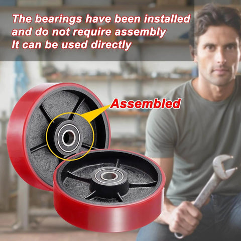 Pallet jack steering wheels set 7 x 2 inch with axle, red polyurethane tread on steel, bearings installed, mechanic with wrench.