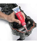Applying High-Temp Red RTV Silicone Gasket Maker, 3 Oz, Go-To Heavy-Duty Sealant for replacing cut gaskets on engine part